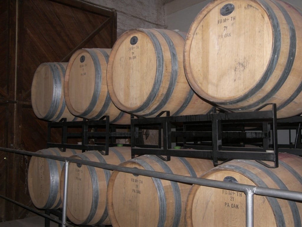 Oak barrels stacked in the cellar